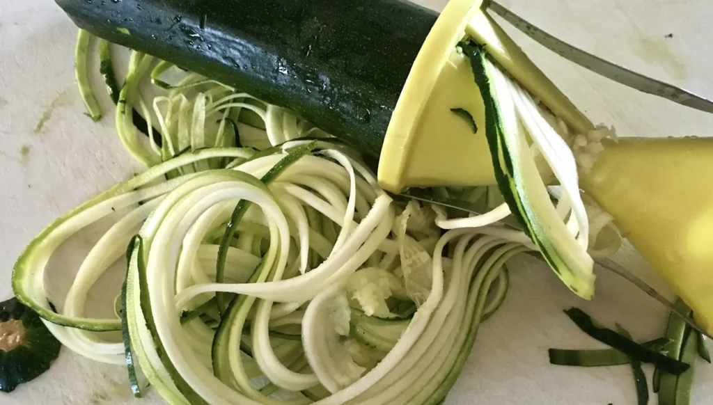 spiralizer and zucchini with shredded zucchini