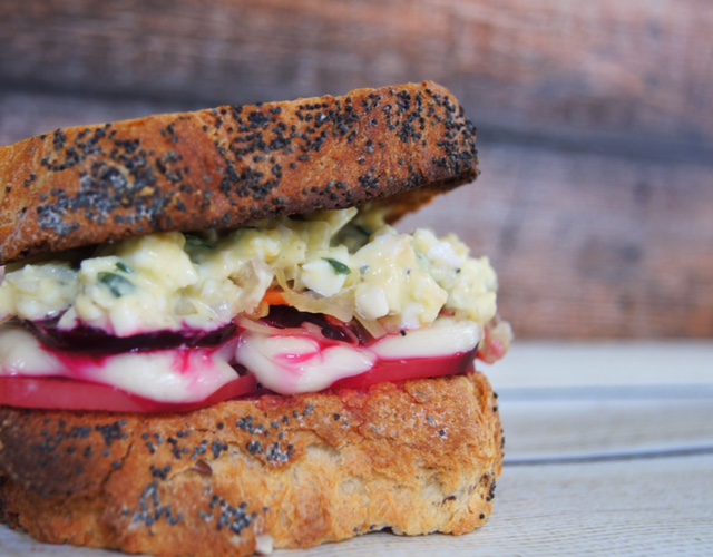 side view of roasted beets with egg salad sandwich