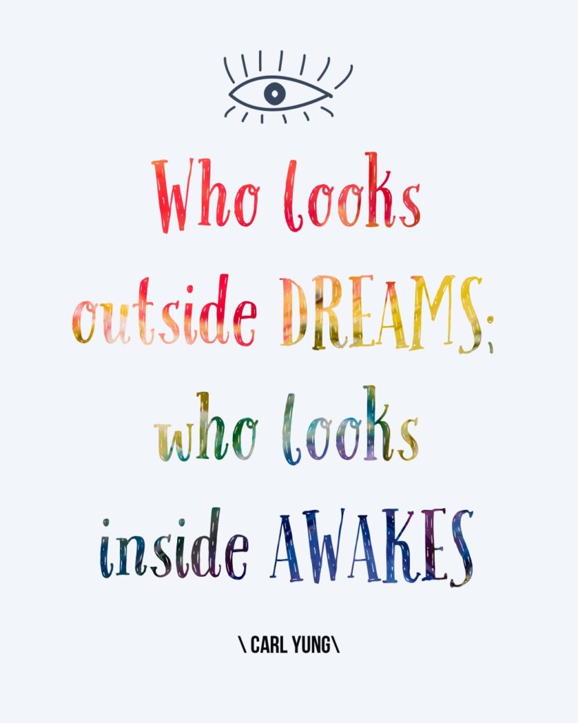 text that says "who looks outside dreams; who looks inside awakes"