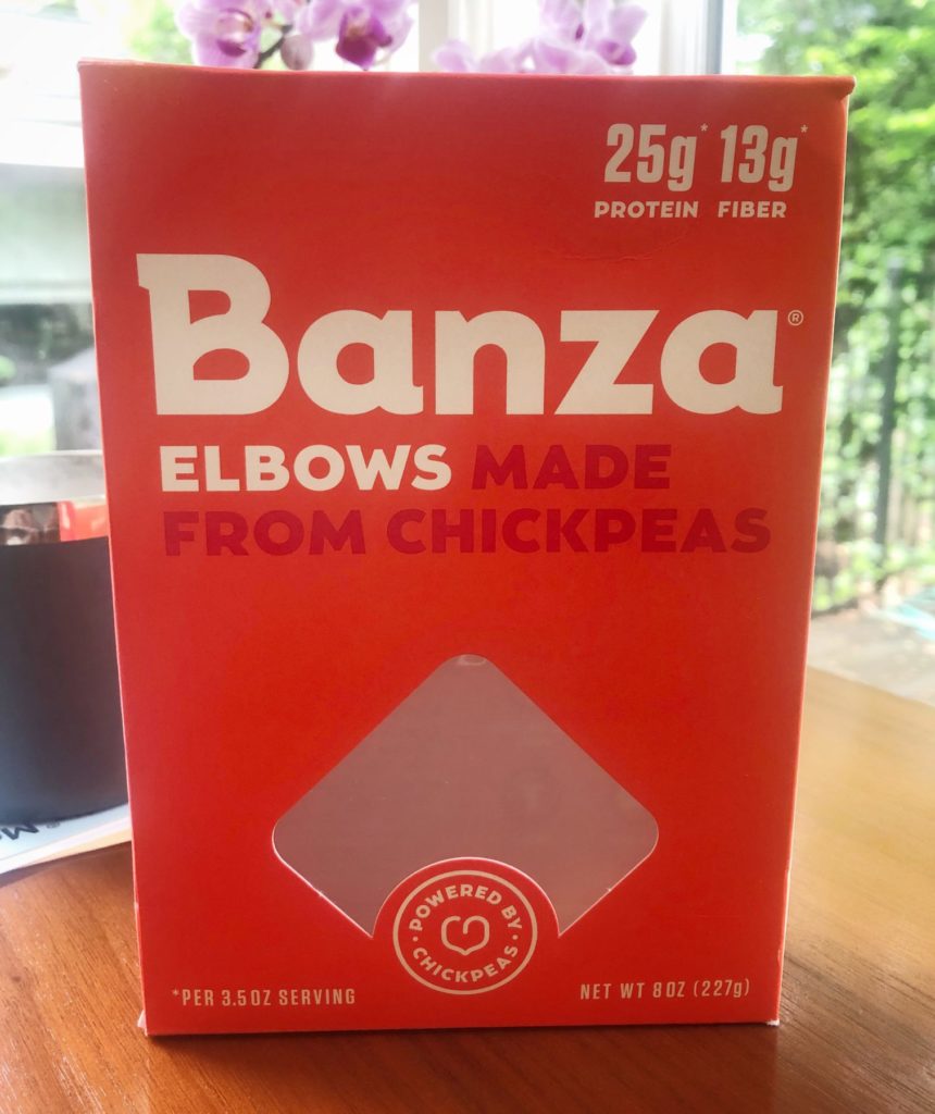 Box of banza pasta, red box on a table