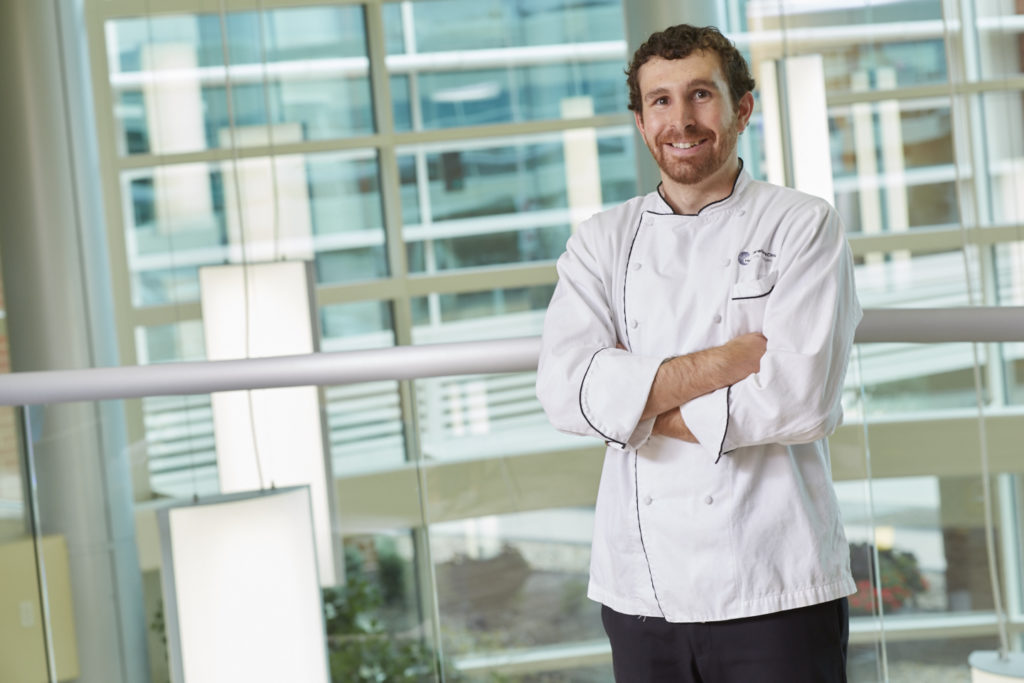 chef smiling in a well lit room