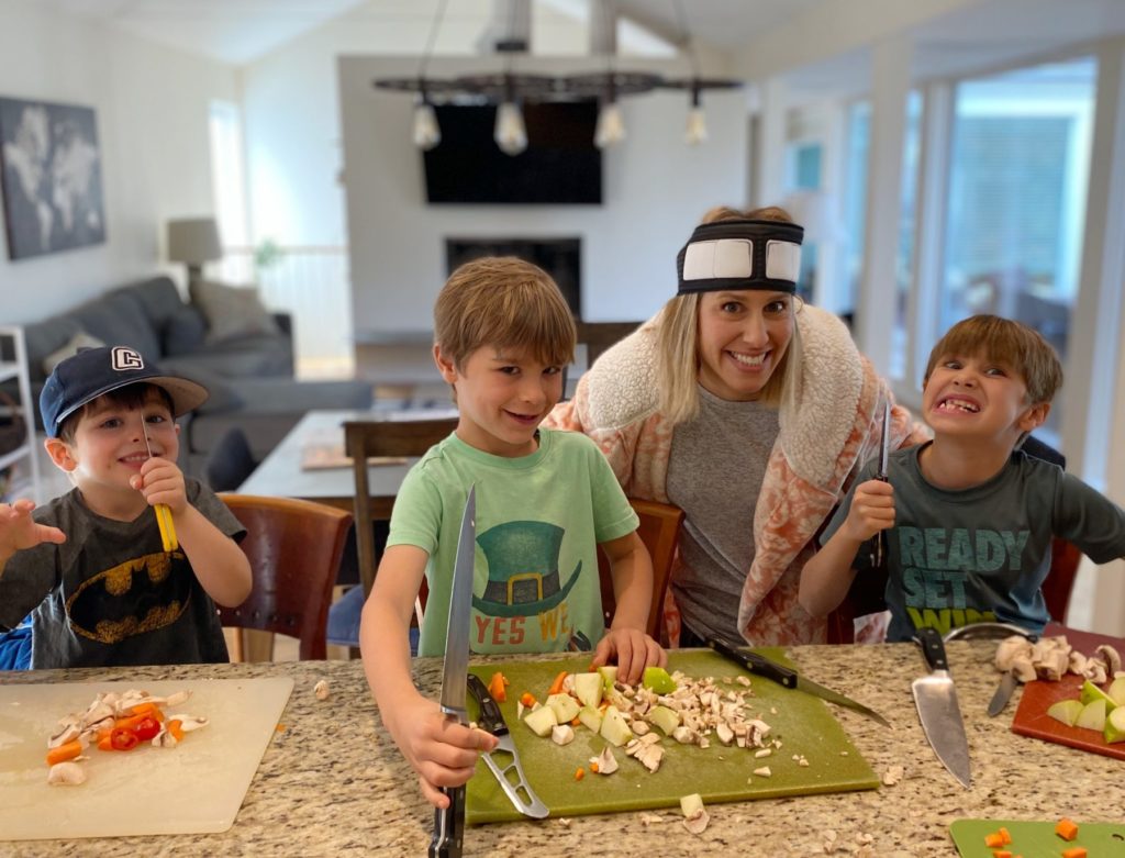 mom and her boys cooking holding knives
