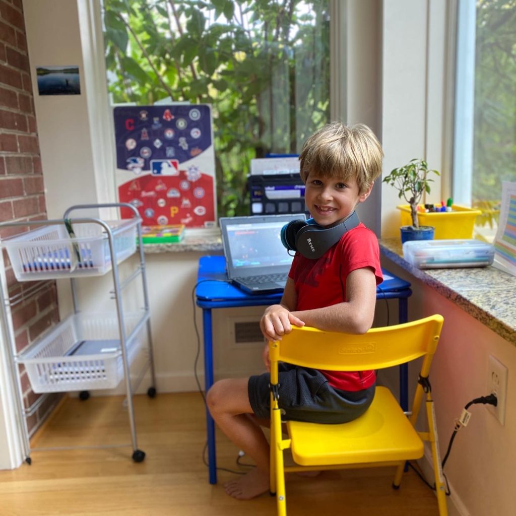 boy at his desk in his house
