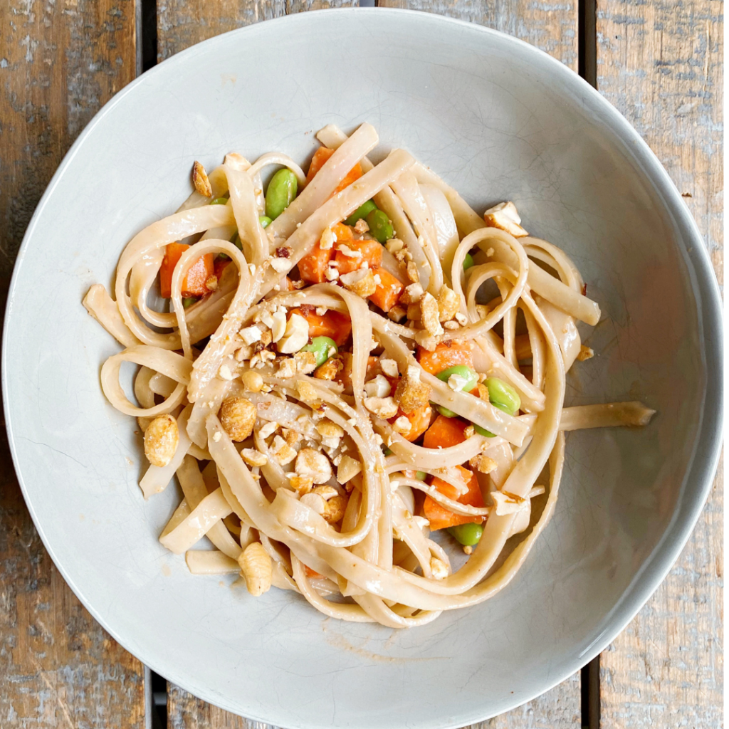 rice noodle bowl with edamame and carrots