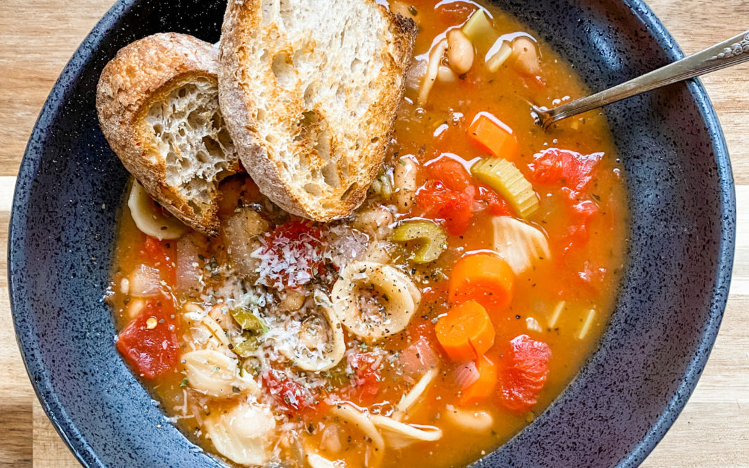 pasta e fagioli soup in a black bowl