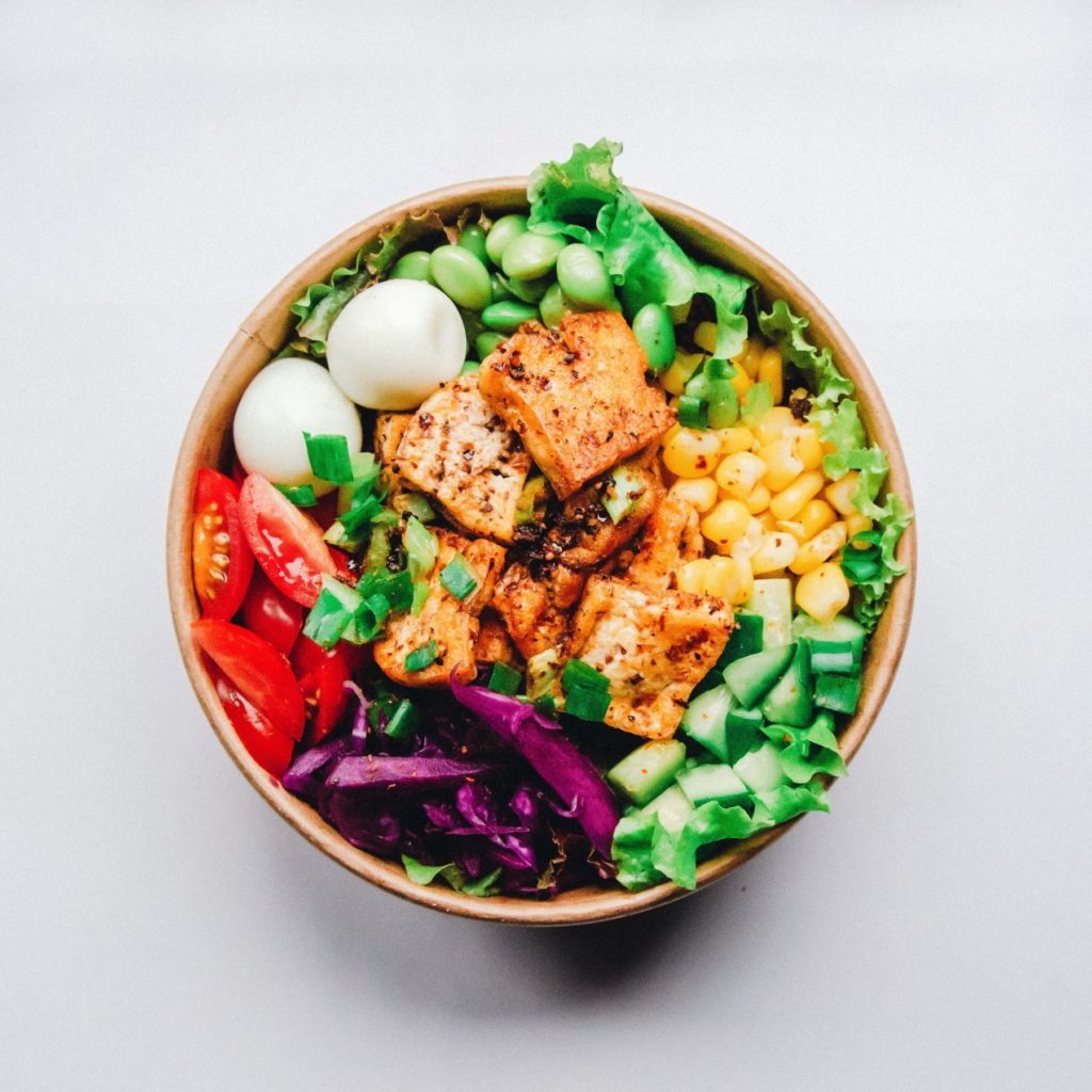 tofu bowl with greens and eggs