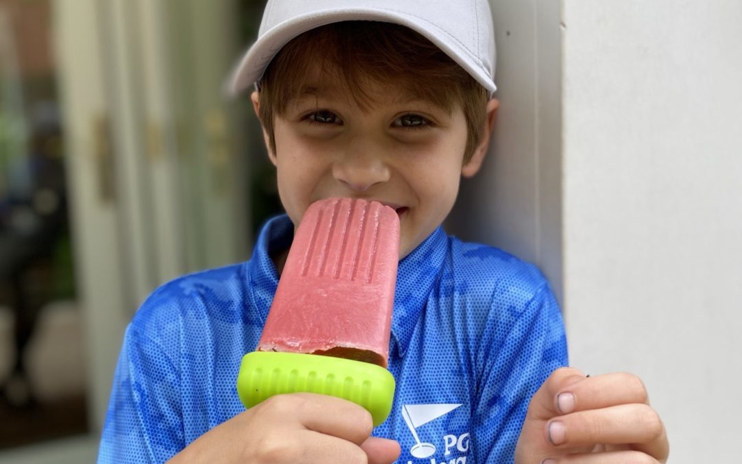 boy eating a popsicle