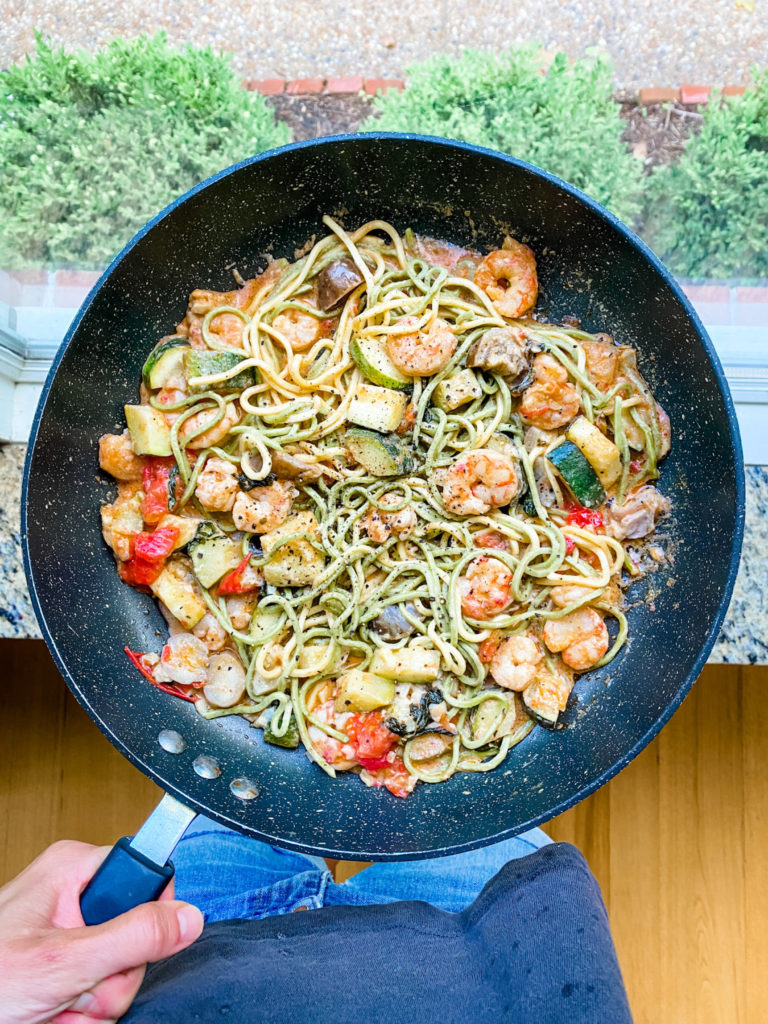 shrimp and ramen in a pan
