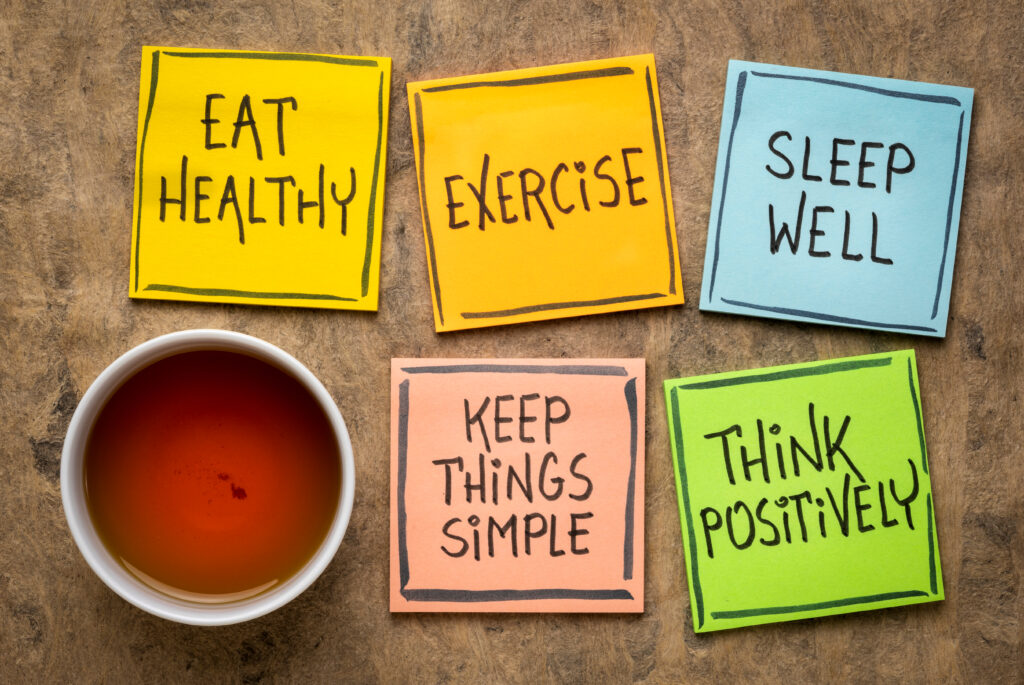 components of healthy eating on post it notes with a cup of tea