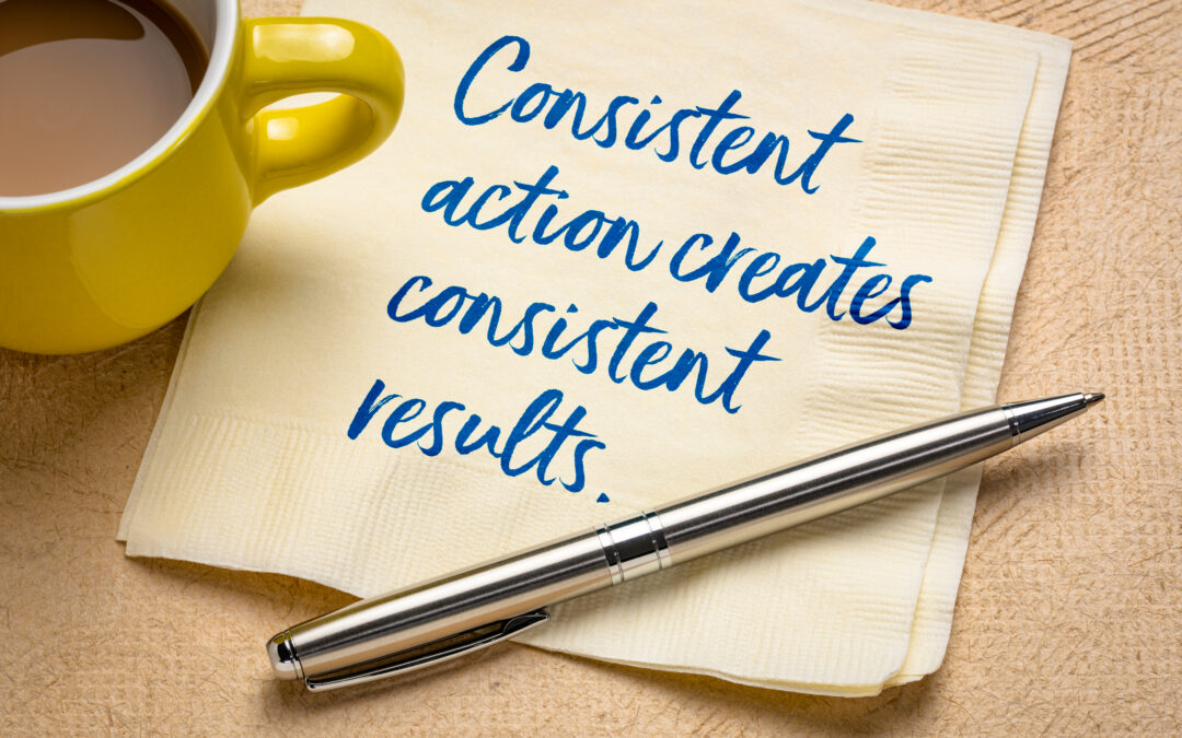Quote about consistency written on a napkin "consistent action creates consistent results"