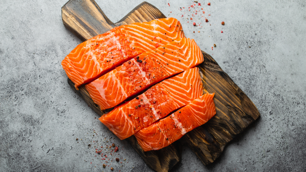 raw salmon on a wood board
