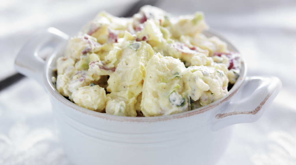 potato salad in a white small serving dish

