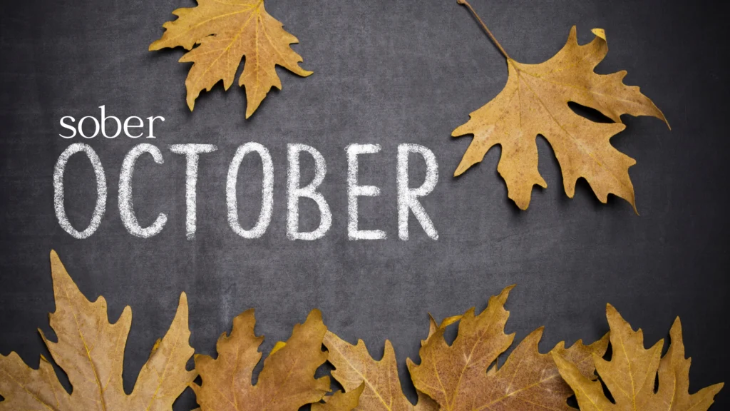 words that say "sober october" with leaves in the background