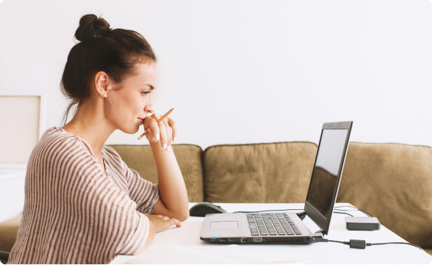Woman at a laptop reviewing her BCBS benefits before a nutrition counseling visit